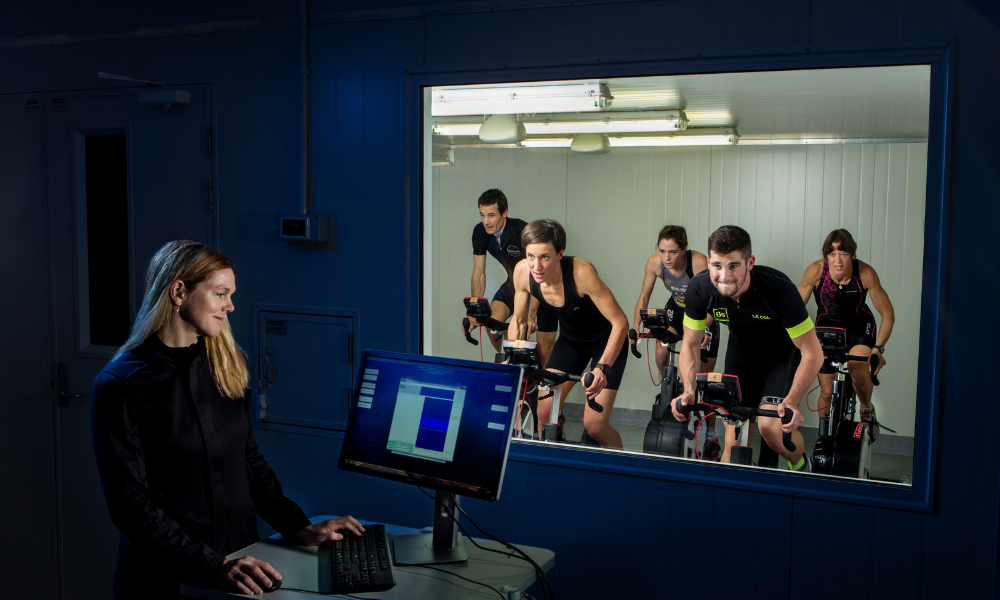 Althletes on bikes being tested in the sports science laboratory